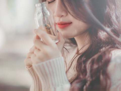 Causes Of Cold Sores And Their Remedies woman holding bottle